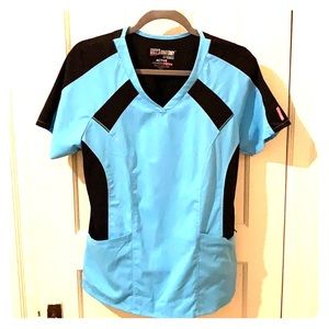 4 gently used scrub tops! Assorted colors/patterns